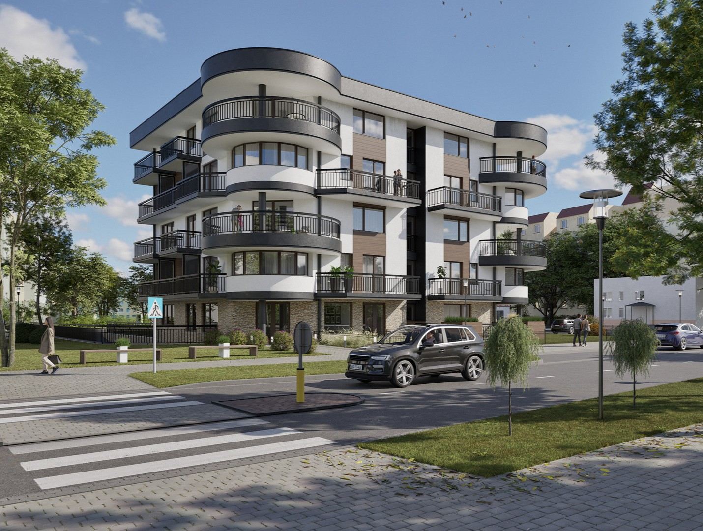 Budynek Przystań.Ustka z zaokrąglonymi balkonami i kamienną podmurówką